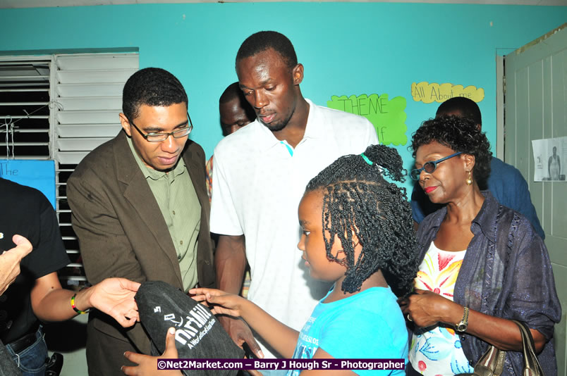 Usain Bolt of Jamaica - The Fastest Man In The World  - Usain Bolt Homecoming Celebrations - Press Conference at the Grand Bahia Principe &amp; Sherwood Content - Waldensia Primary School - Photographs by Net2Market.com - Barry J. Hough Sr. Photojournalist/Photograper - Photographs taken with a Nikon D300 - Negril Travel Guide, Negril Jamaica WI - http://www.negriltravelguide.com - info@negriltravelguide.com...!